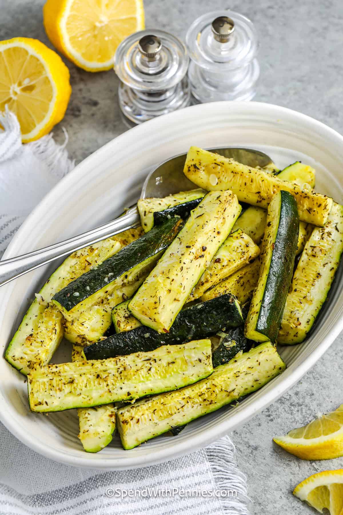 plated Easy Roasted Zucchini with a spoon