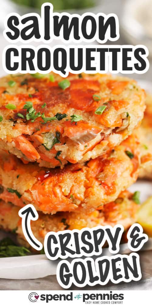 crispy and golden Salmon Croquettes in a stack on a plate with a title