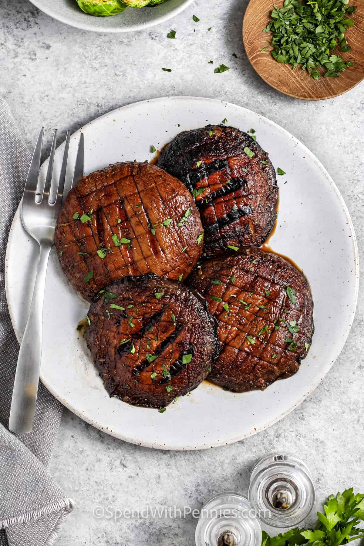 Grilled Portobello Mushrooms on a plate with a fork