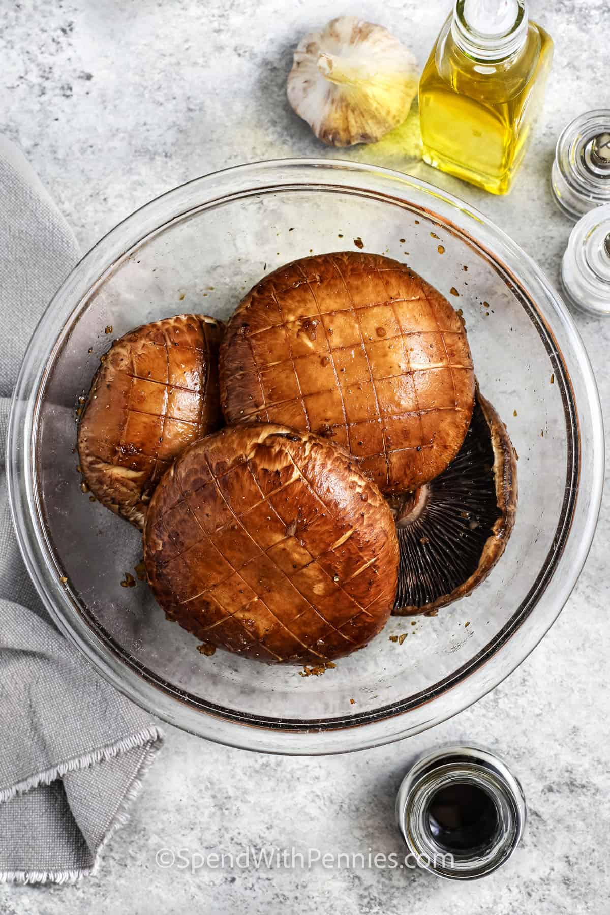 mushrooms with seasonings to make Grilled Portobello Mushrooms