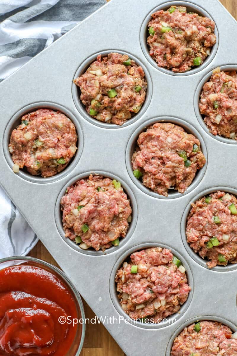 Meatloaf Muffins in a baking pan ready to cook