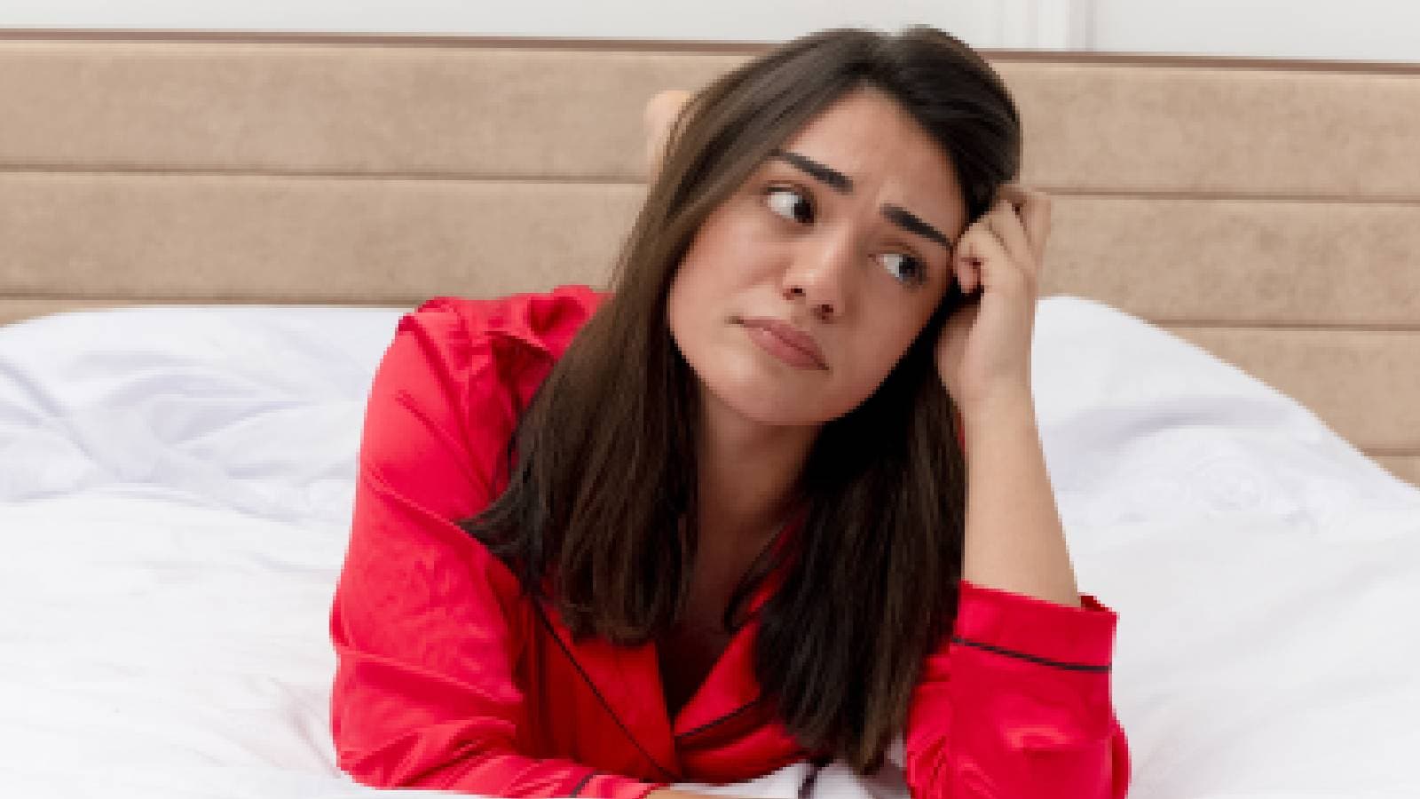 A woman stressed in bed