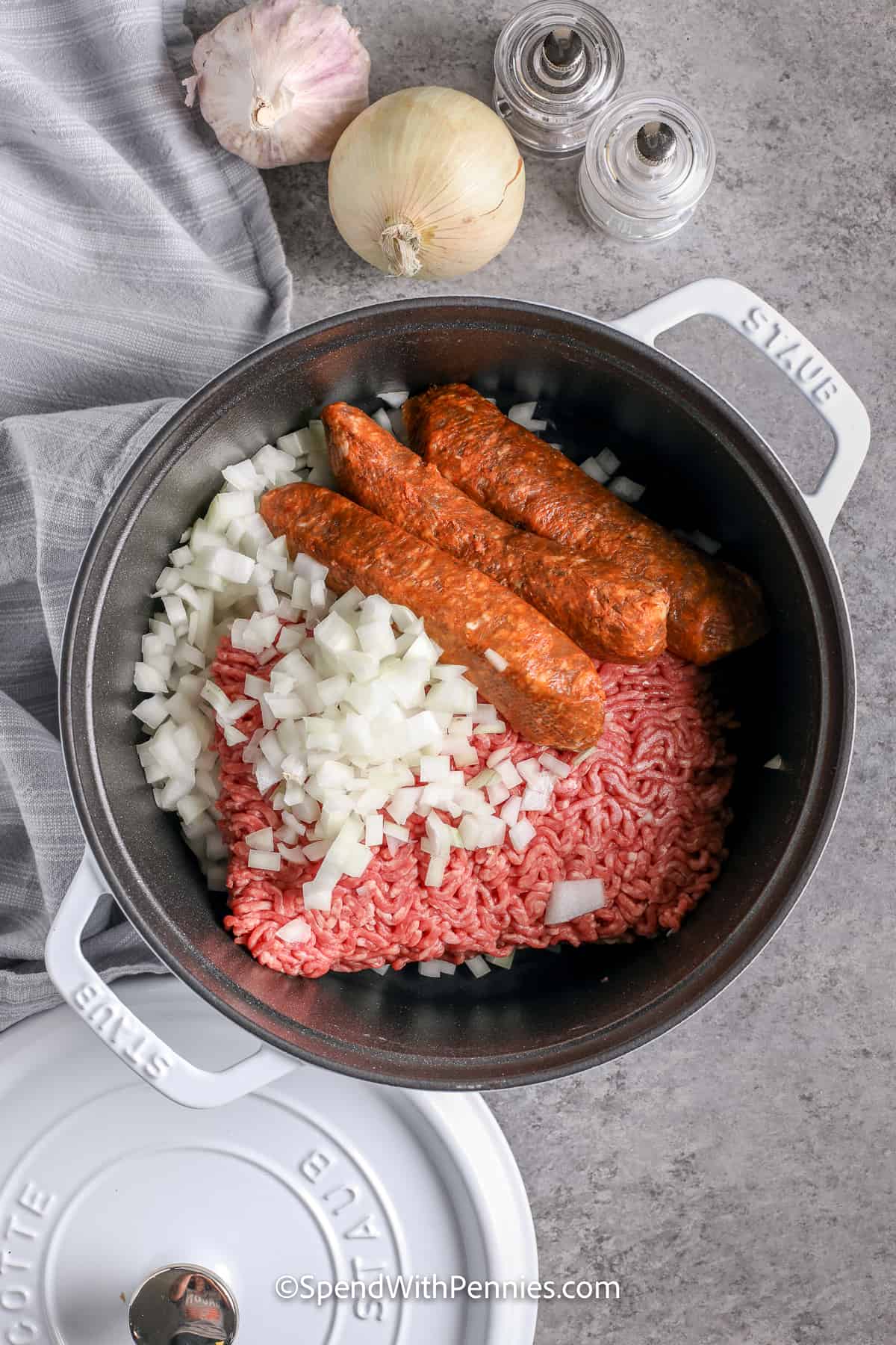 sausage, ground beef, and onions in a pot