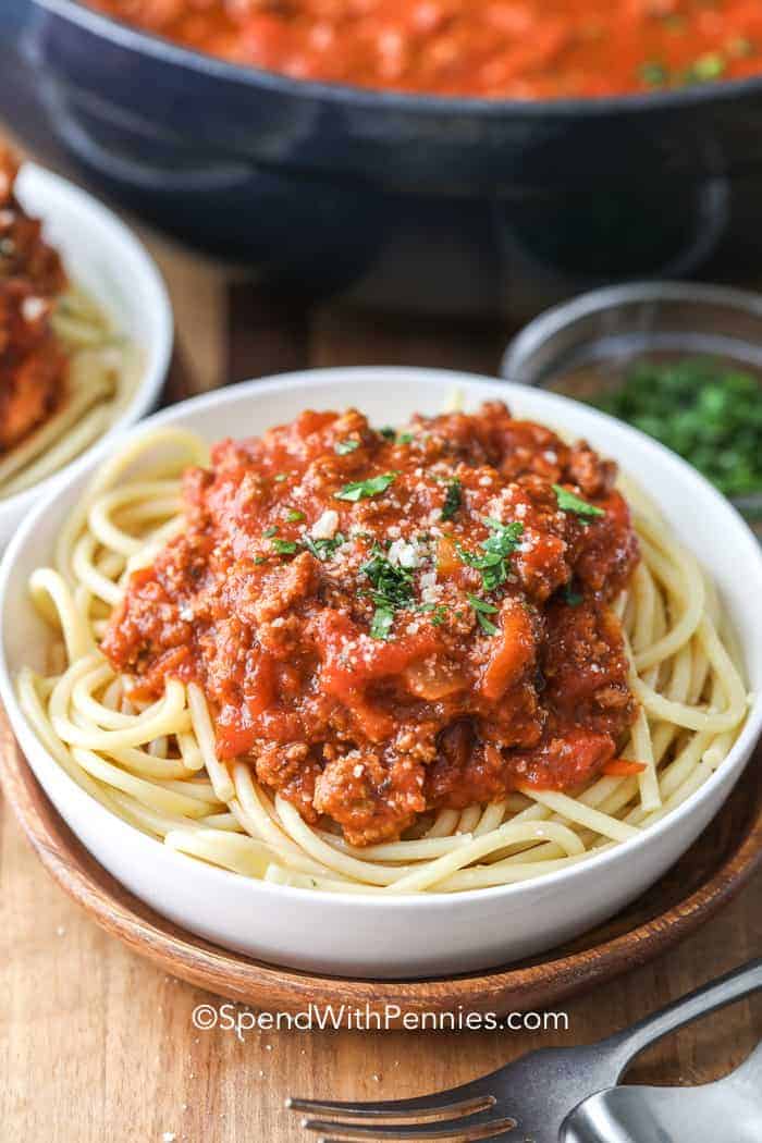 Spaghetti with Meat Sauce on top in a white bowl