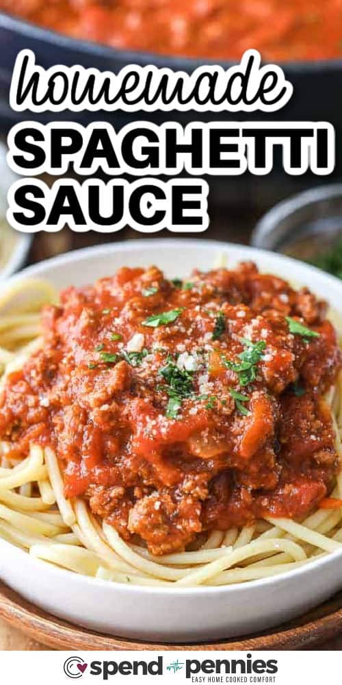 meaty Homemade Spaghetti Sauce on spaghetti plated on spaghetti with a title