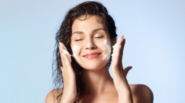 A woman using face wash