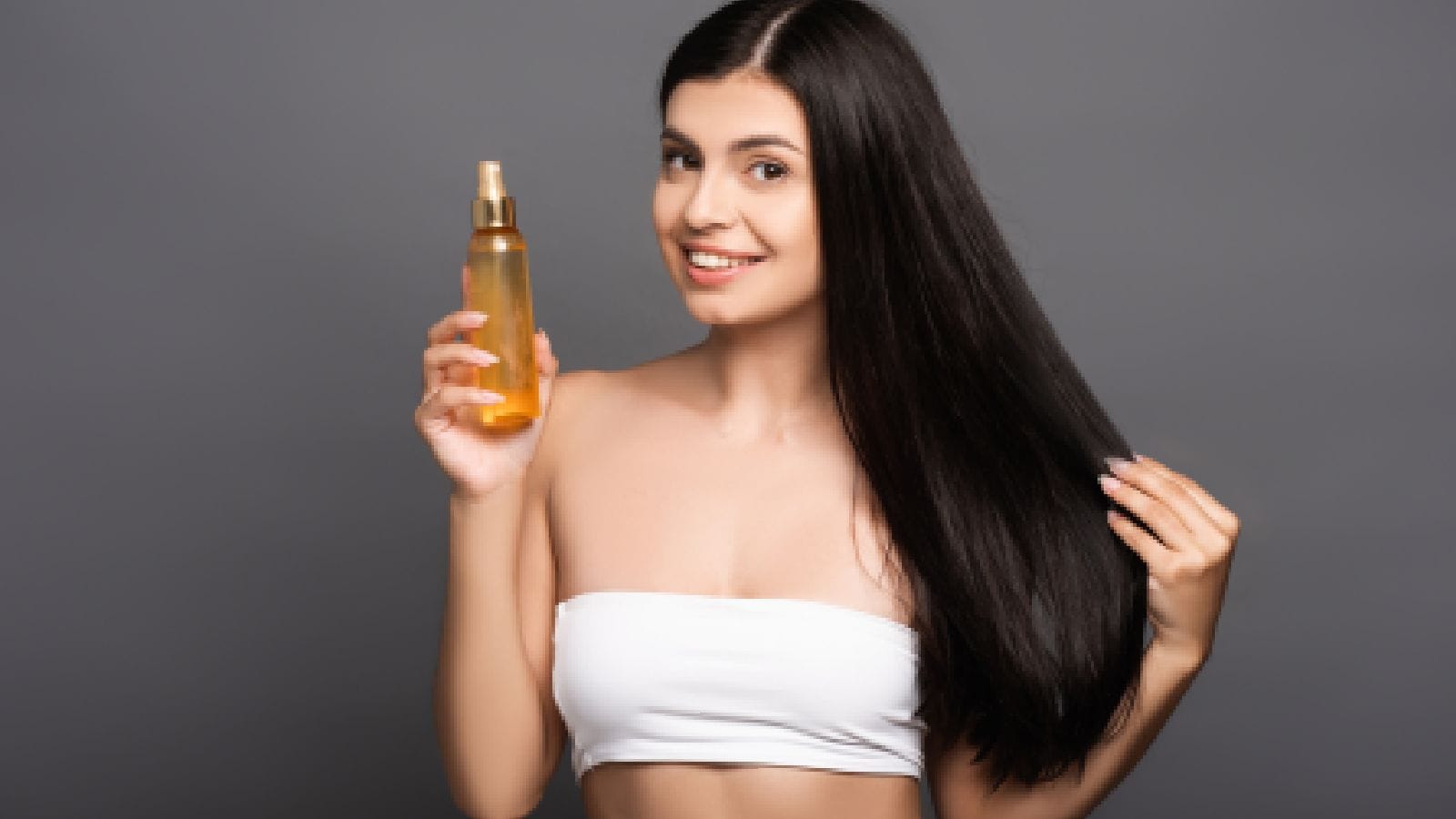 A woman using oil for hair