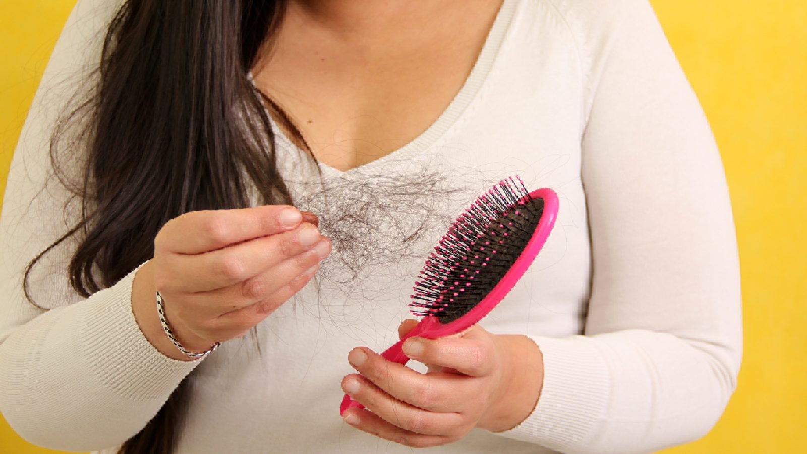 Woman experiencing hair loss