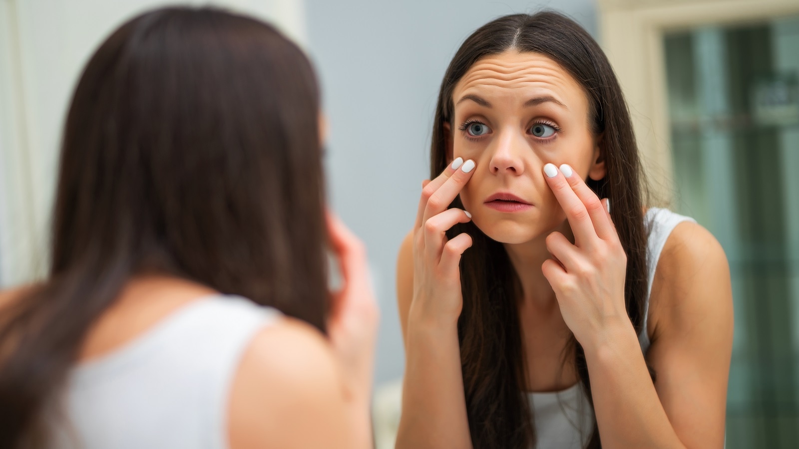 A woman with dark circles