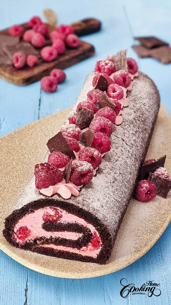 Chocolate Raspberry Cake Roll with fresh raspberries and chocolate shards