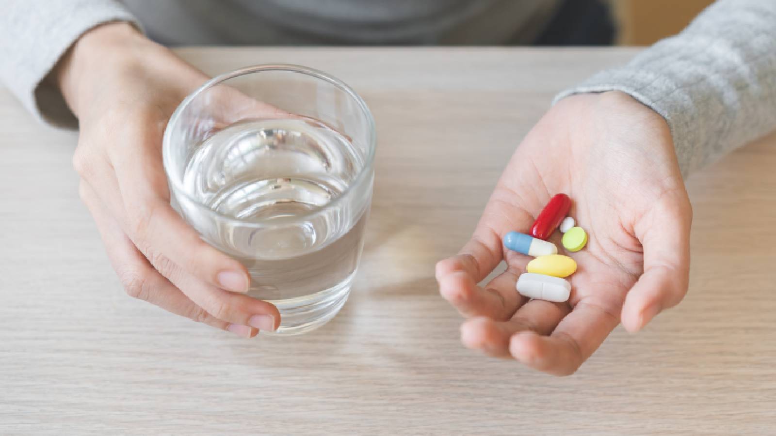 Supplements with a glass of water