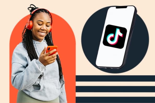 A marketer smiles at her smartphone as her TikTok gains more followers