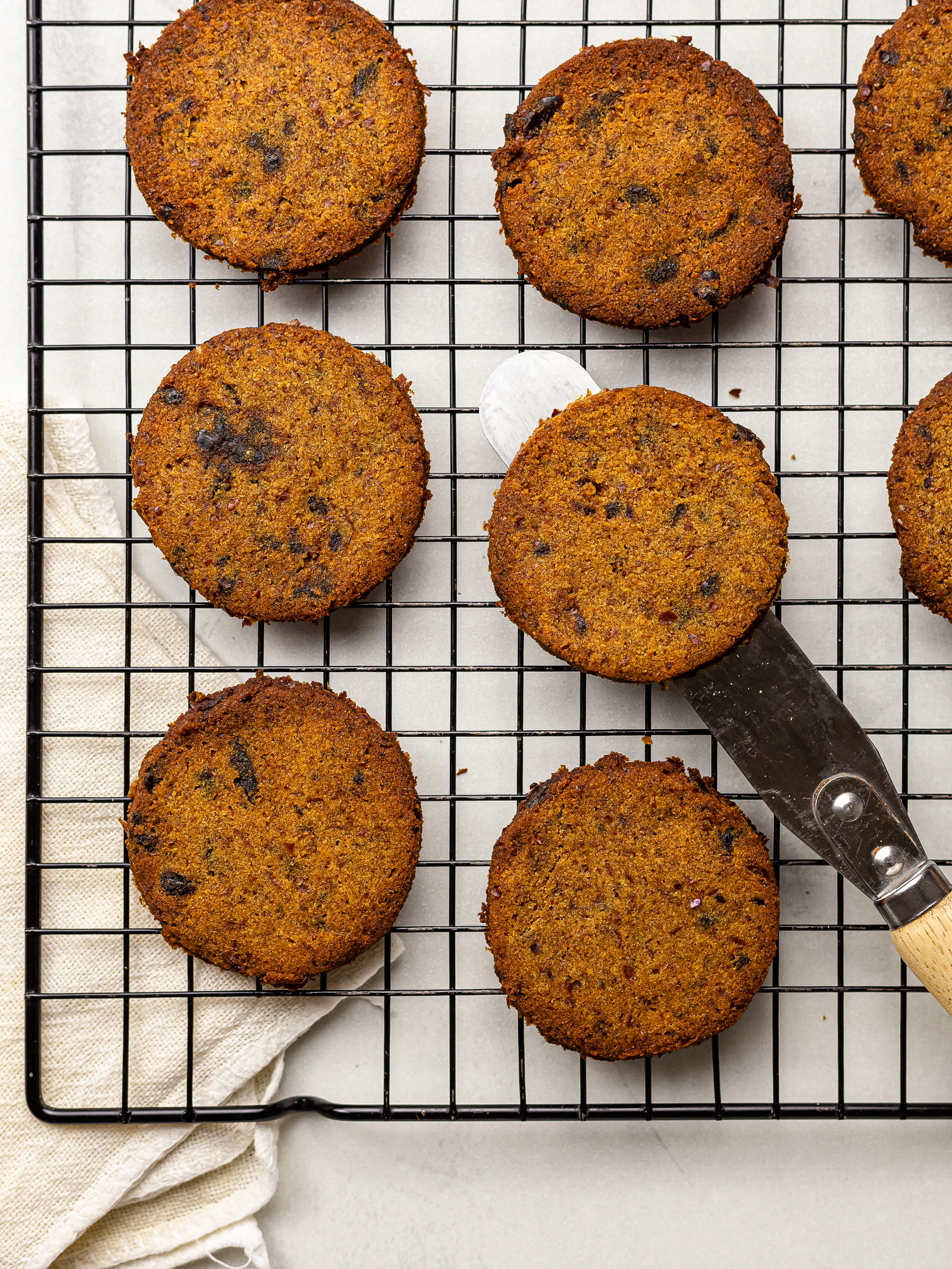 baked almond pulp cookies on a cooling rack