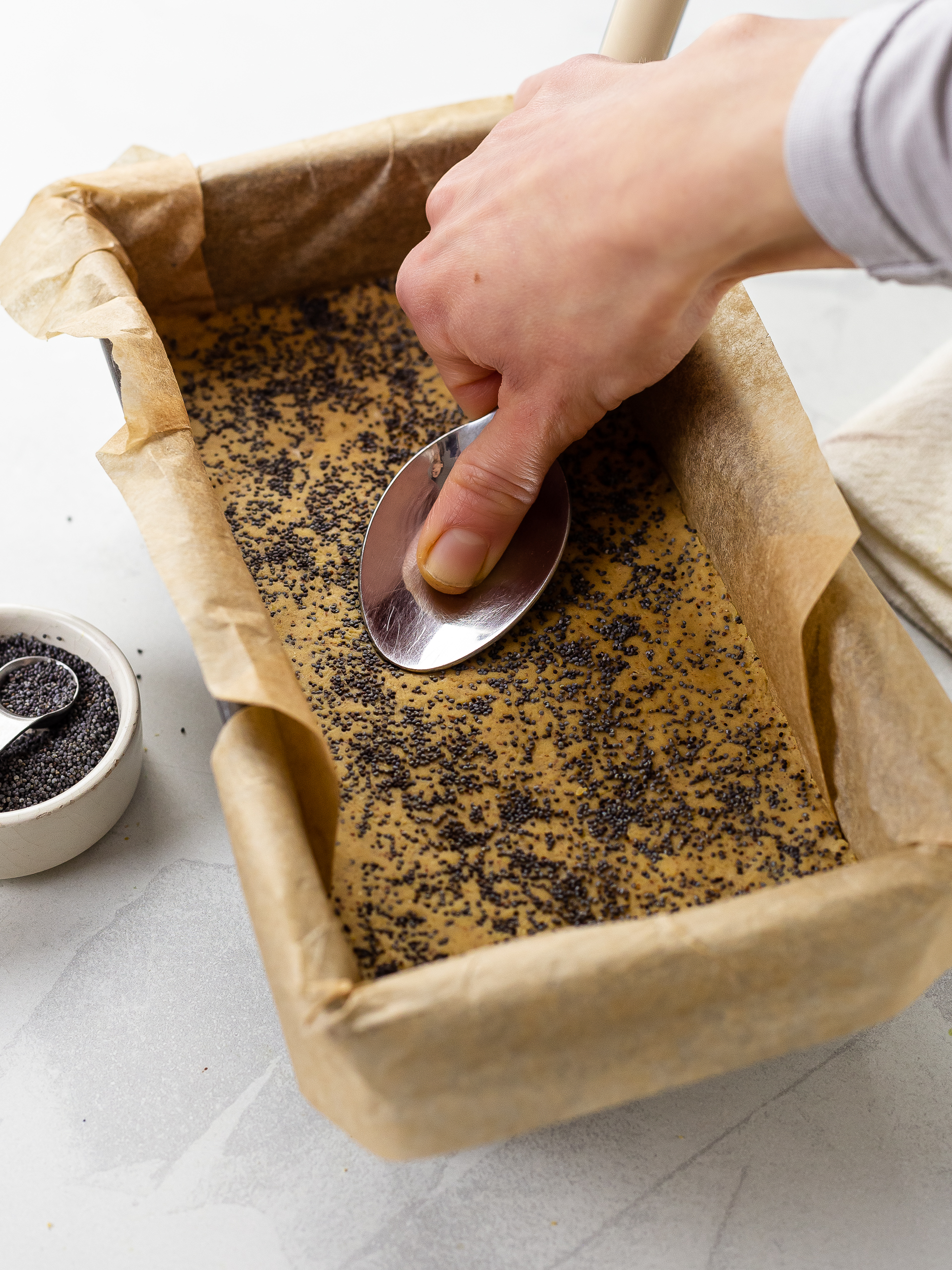 lemon bar mixture flattened into a loaf tin