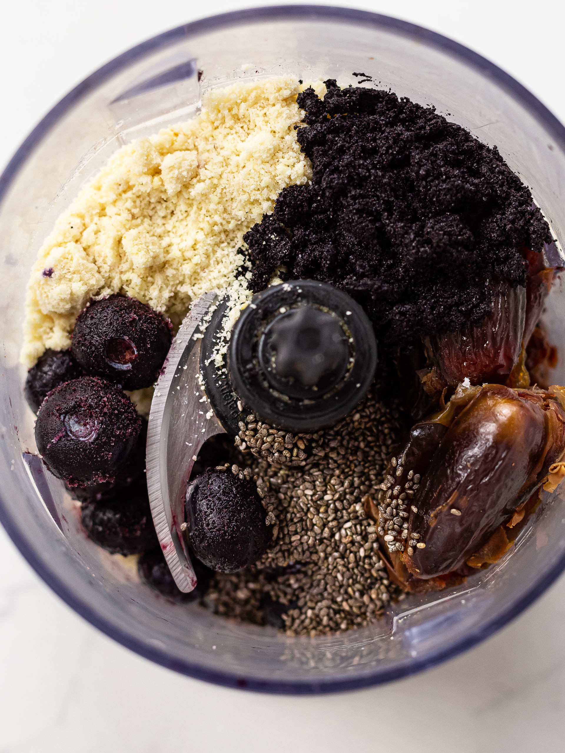 blueberries, acai berry powder, dates, chia seeds and ground almonds in a blender