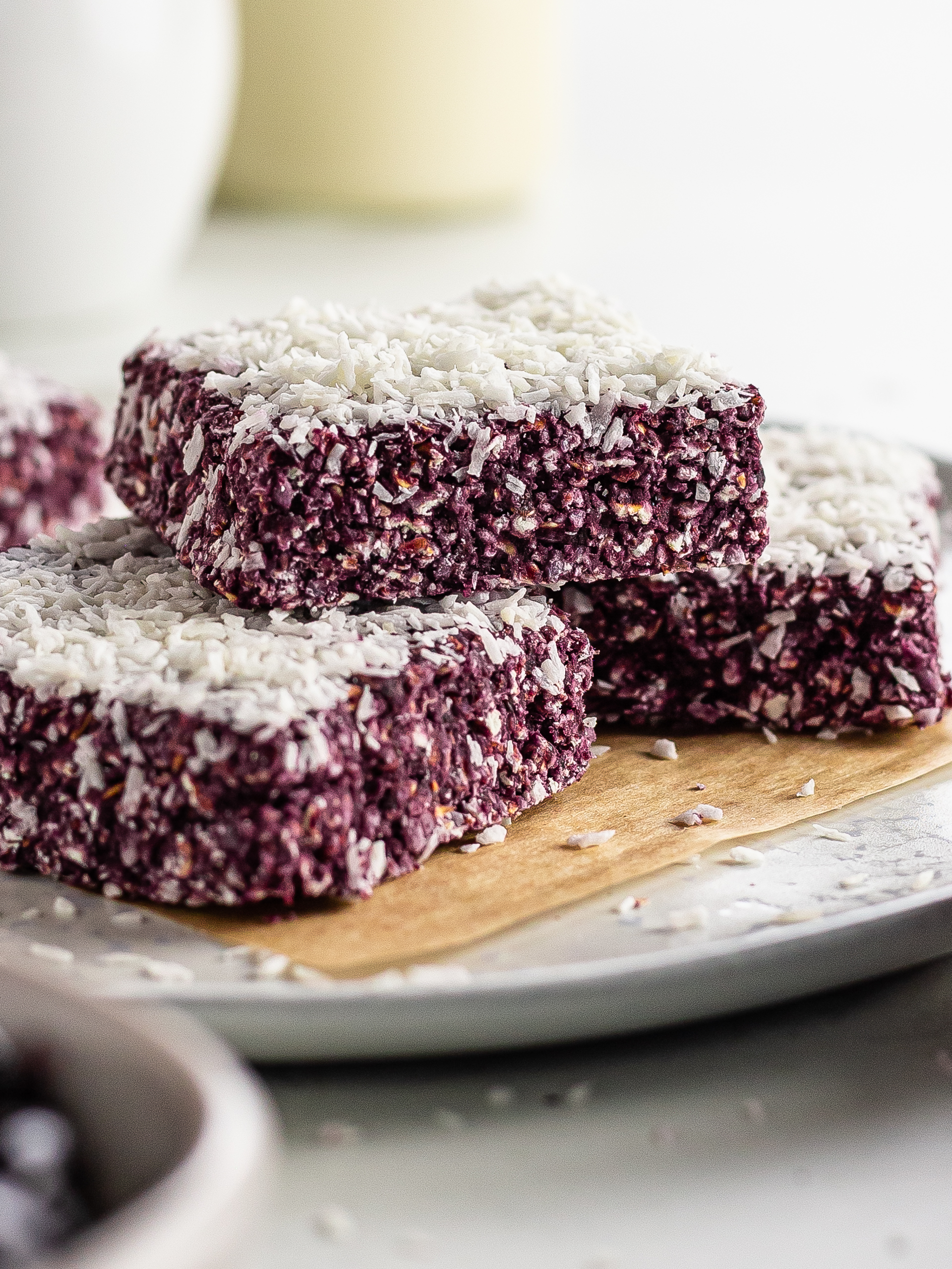 a stack of cherry coconut flapjack bars