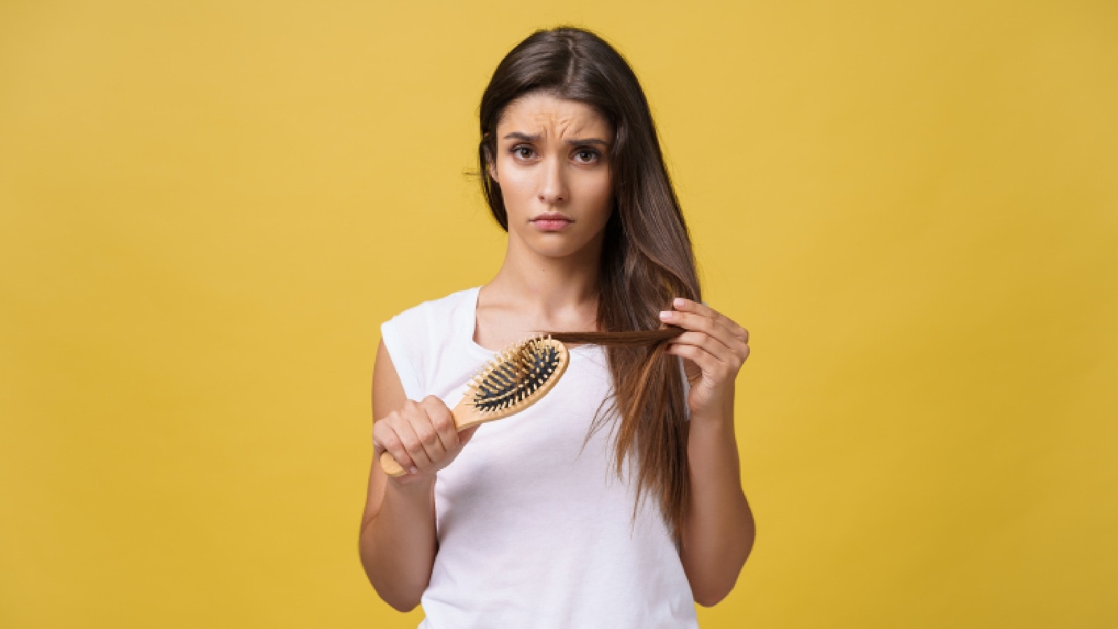 Woman experiencing hair loss due to iron deficiency 