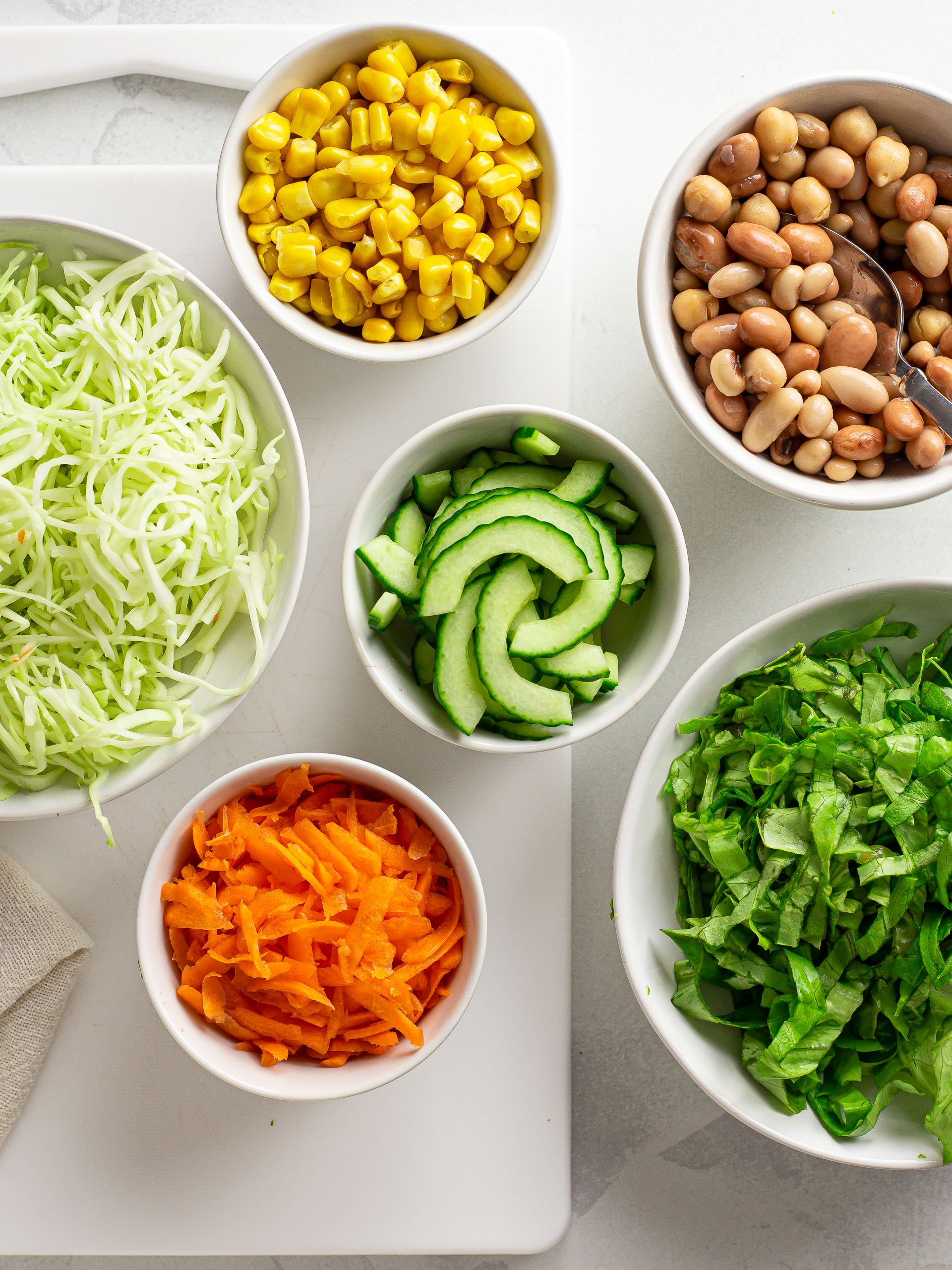 prepared vegetables, corn, and beans for salad