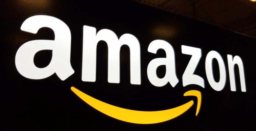 amazon logo on black wall 190121941 bigstock scaled