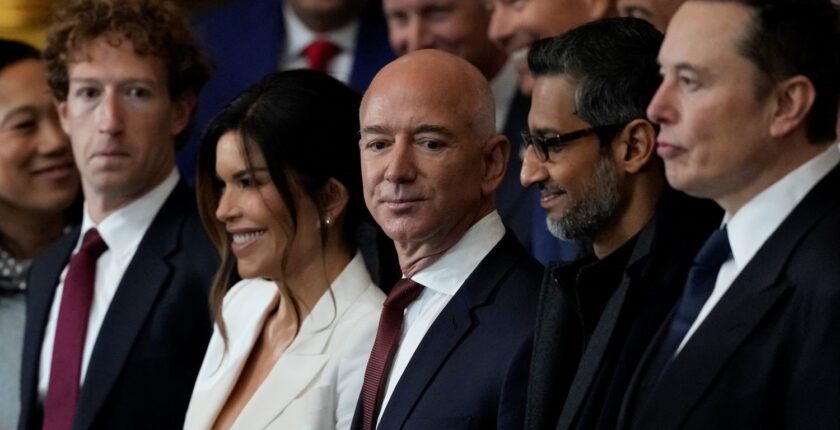 Mark Zuckerberg, Lauren Sanchez, Jeff Bezos, Sundar Pichai and Elon Musk stand in a line during the Inauguration of Donald J. Trump in the U.S. Capitol Rotunda.